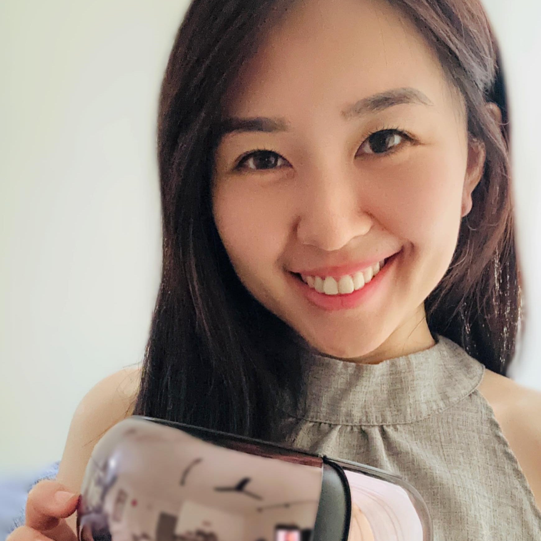 Smiling lady with iREST EyeWell Relaxing Massager