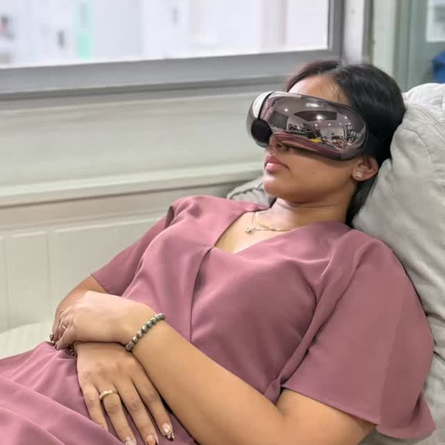 Lady taking power nap with her iREST EyeWell Relaxing Massager