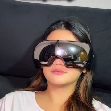 Young lady taking a break with iREST EyeWell Relaxing Massager