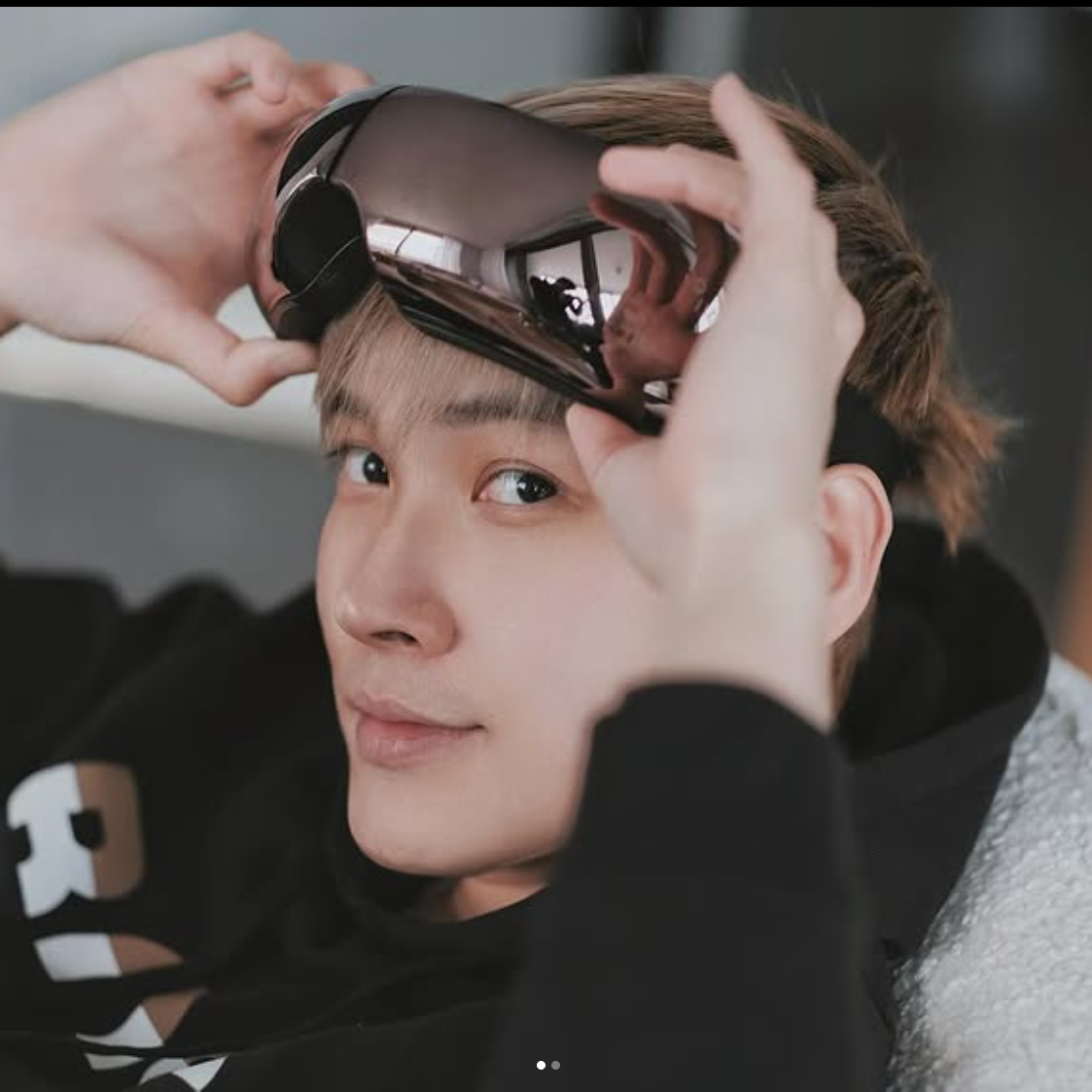 Young man looking relaxed after using iREST EyeWell Relaxing Massager