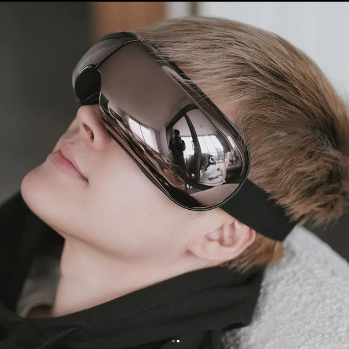 Man enjoying his iREST EyeWell Relaxing Massager