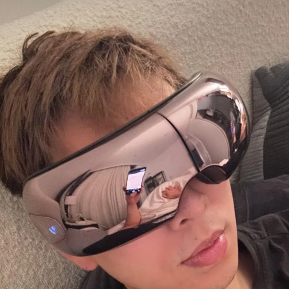 Man unwinding with his iREST EyeWell Relaxing Massager
